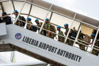 FILE PHOTO - United Nations troops from Nigeria board a plane at the Roberts International Airport, outside Monrovia, Liberia February 8, 2018. Albert Gonzalez Farran/UNMIL/Handout via REUTERS