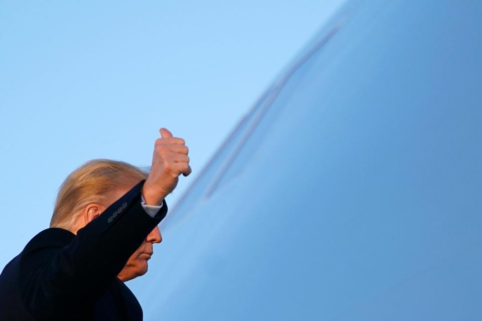 President Donald Trump boards Air Force One at Andrews Air Force Base, Md., on Dec. 23, 2020.