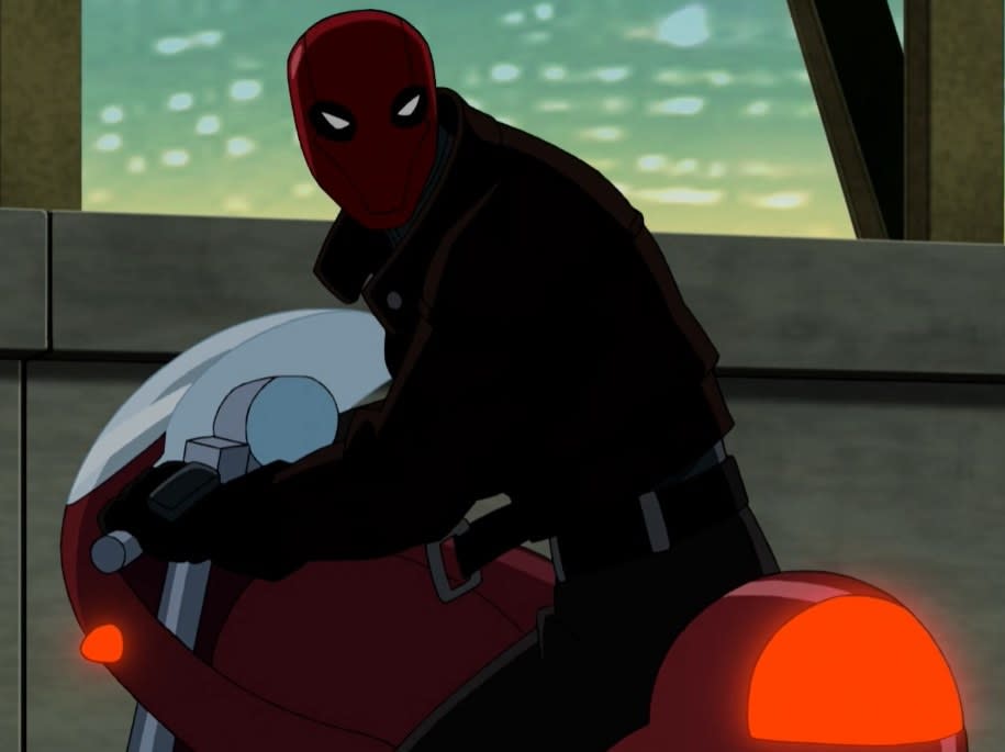 Red Hood looking back on a motorcycle