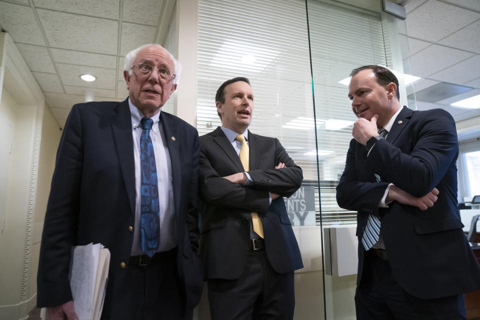 From left, Sen. Bernie Sanders, I-Vt., Sen. Chris Murphy, D-Conn., and Sen. Mike Lee, R-Utah, meet before holding a news conference on the Senate vote on ending U.S. support for the Saudi Arabian-led coalition fighting in Yemen, at the Capitol in Washington, Wednesday, March 13, 2019. (AP Photo/J. Scott Applewhite)