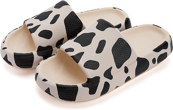 black and white cow print cloud slippers