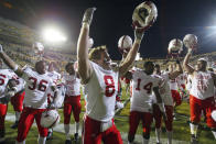 FILE - Nebraska safety Andrew Shanle (8) celebrates with teammates after Nebraska's 30-3 win over Colorado, Friday, Nov. 25, 2005, in Boulder, Colo. Thomas Lawson (36) and Daniel Bullocks (14) join in. The current football players at Nebraska and Colorado weren't alive when the rivalry between the schools was in its heyday. They are getting a history lesson this week in the build-up to Saturday's game in Boulder, Colorado. (AP Photo/Jack Dempsey, File)