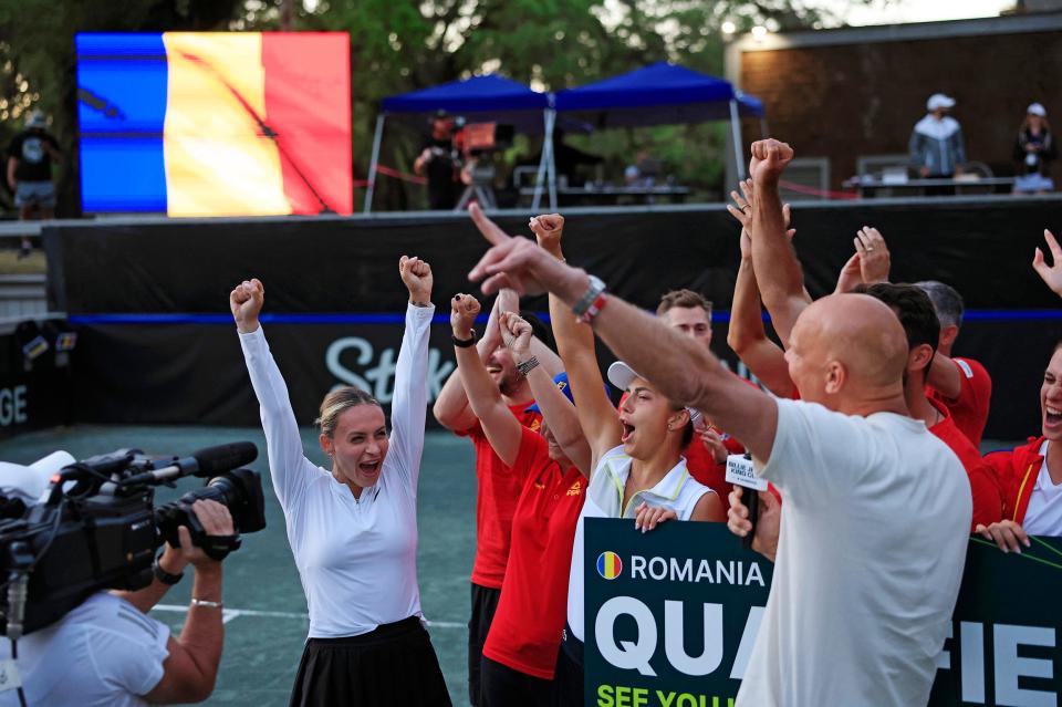 Romania's Ana Bogdan, left, celebrates the win with the team during the Billie Jean King Cup women's tennis tournament Saturday at Racquet Park at Omni Amelia Island in Fernandina Beach.