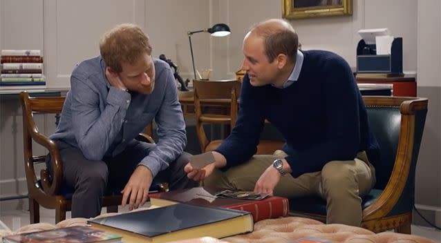 William and Harry looking at Diana's personal photographs.