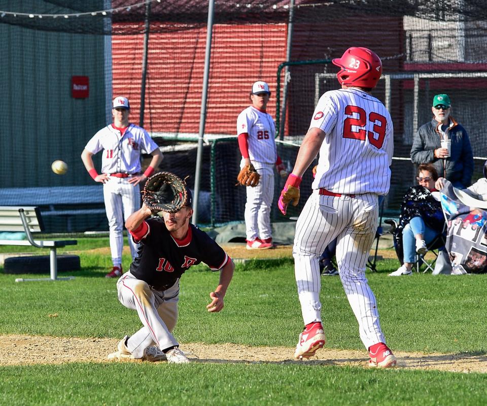 Durfee’s Aiden Travers stretches to get Bridgewater-Raynham’s Tyler Cattoggio during Wednesday’s game against