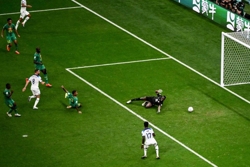 Jordan Henderson scores England’s first goal past Senegal’s Edouard Mendy (AFP/Getty)