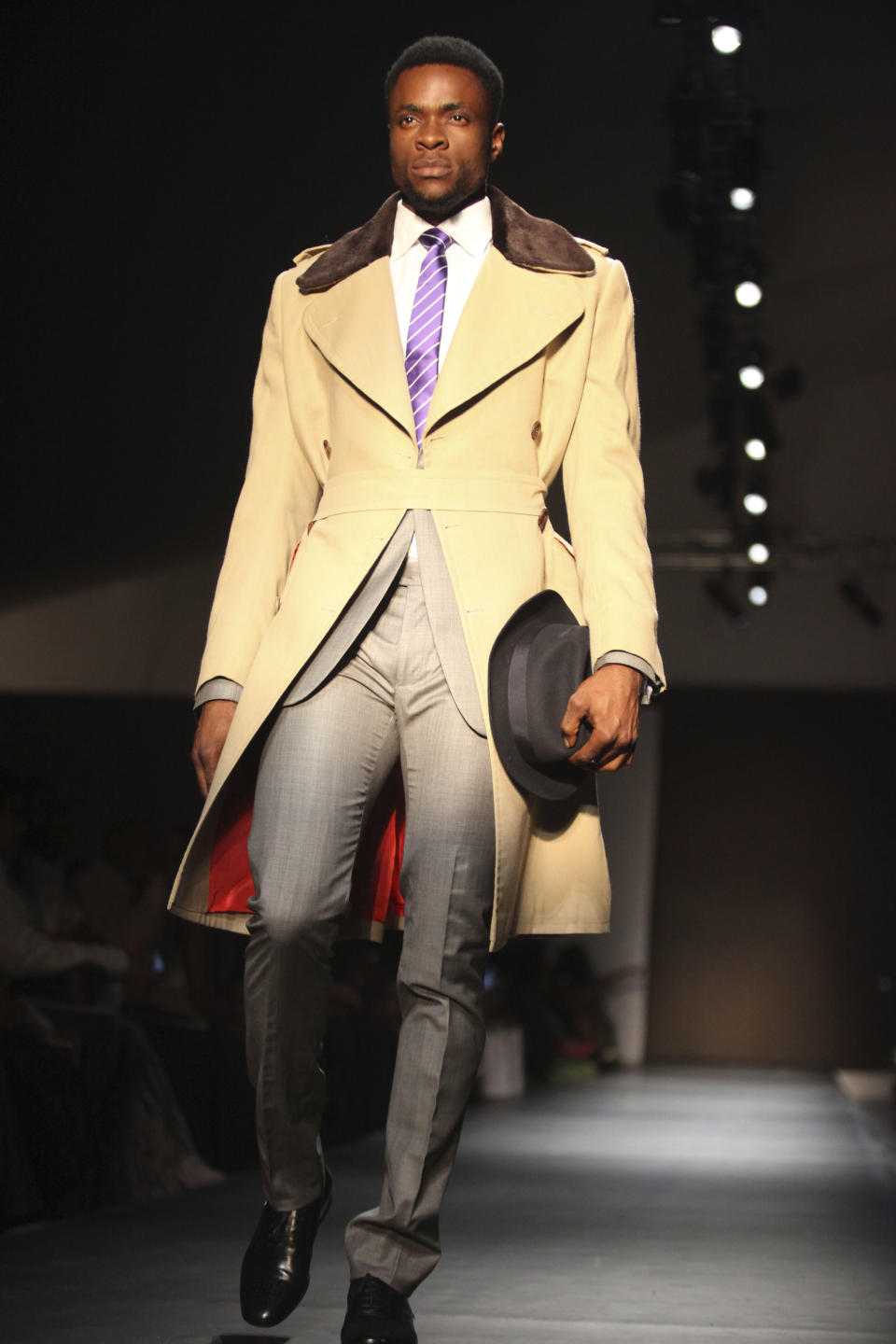 A model displays an outfit during the ARISE Fashion Week event in Lagos, Nigeria on Sunday, March 11, 2012. (AP Photos/Sunday Alamba)