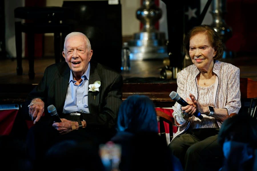 FILE – Former President Jimmy Carter and his wife former first lady Rosalynn Carter sit together during a reception to celebrate their 75th wedding anniversary Saturday, July 10, 2021, in Plains, Ga. Jimmy and Rosalynn are celebrating their 77th wedding anniversary, Friday, July 7, 2023. (AP Photo/John Bazemore, Pool, File)
