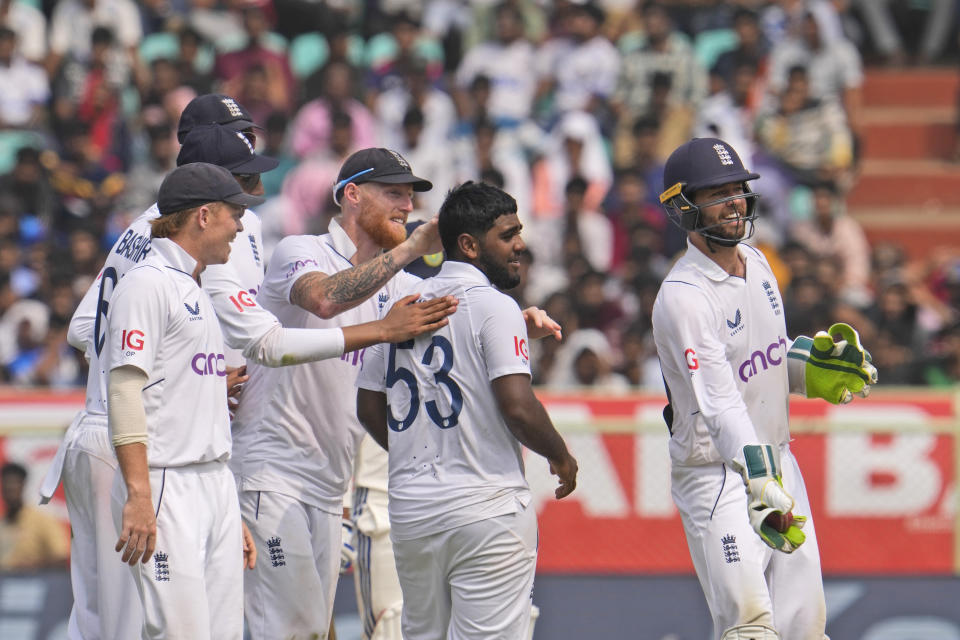 England players congratulate Rehan Ahmed , center, for taking the wicket of India's Rajat Patidar on the third day of the second cricket test match between India and England in Visakhapatnam, India, Sunday, Feb. 4, 2024. (AP Photo/Manish Swarup)