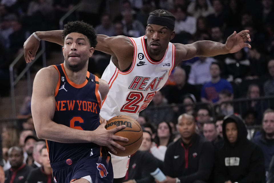 New York Knicks guard Quentin Grimes (6) drives past Miami Heat forward Jimmy Butler (22) in the second half of an NBA basketball game, Wednesday, March 29, 2023, at Madison Square Garden in New York. (AP Photo/Mary Altaffer)