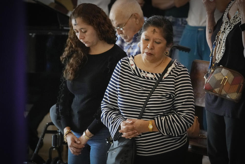 Parishioners attend an Ash Wednesday Mass where they got ashes marked on their foreheads at the Lady of Charity shrine, known as La Ermita, in Miami, Florida, Wednesday, Feb. 14, 2024. The Vatican-recognized Virgin, venerated by Catholics and followers of Afro-Cuban Santeria traditions, is at the heart of Cuban identity, uniting compatriots from the Communist-run Caribbean island to those who were exiled or emigrated to the U.S. (AP Photo/Marta Lavandier)