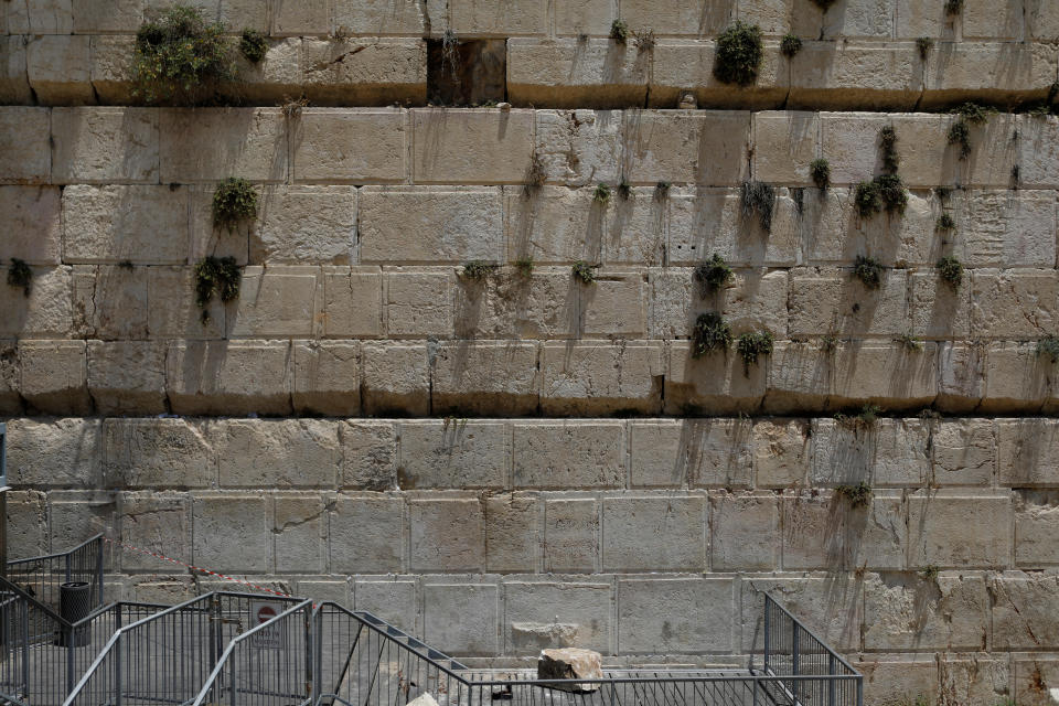 A stone that fell off the Western Wall in Jerusalem can be seen near the wall in Jerusalem's Old City on Monday. (Photo: Nir Elias / Reuters)