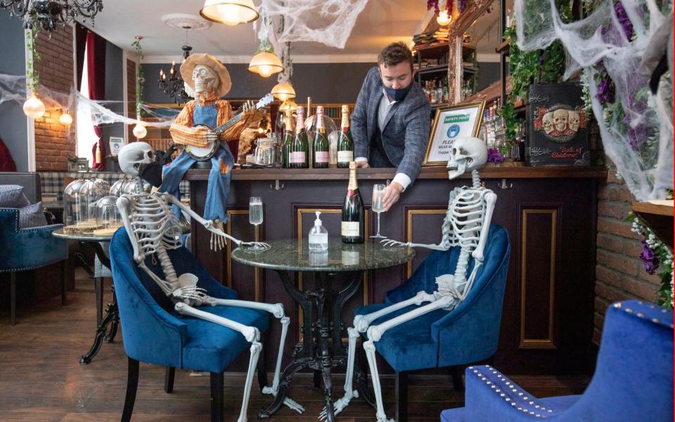 Chris Doherty, owner of Hemingway's in Leith, Edinburgh has decorated his empty restaurant with skeletons. The restaurant has to remain closed during the current lockdown restrictions in the central belt of Scotland - PA