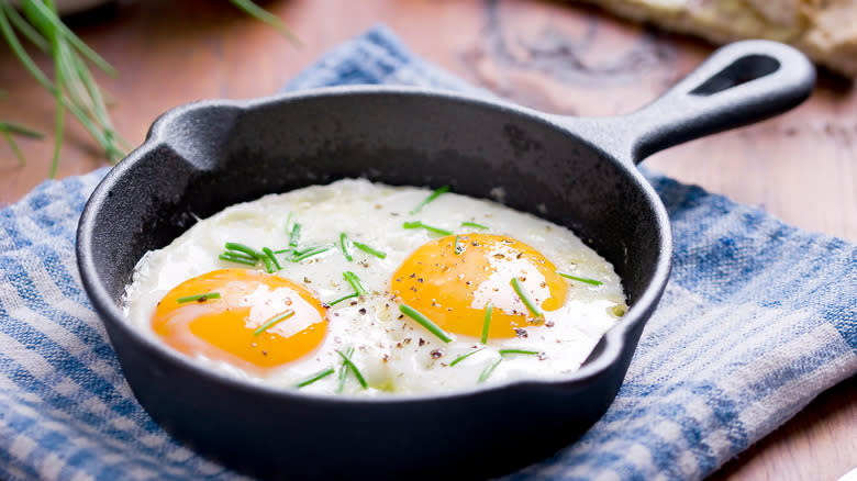 Two fried eggs in pan