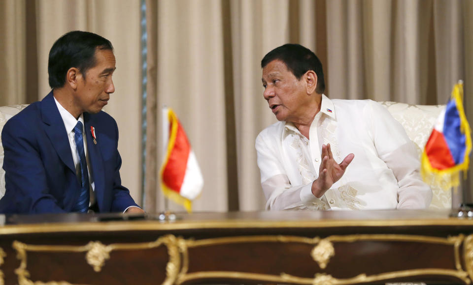 File photo: Philippine President Rodrigo Duterte, right, gestures while talking with Indonesian President Joko "Jokowi" Widodo during a signing ceremony at the Malacanang Palace grounds in Manila, Philippines Friday, April 28, 2017. (AP Photo/Bullit Marquez)