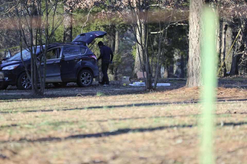 Law enforcement personnel investigate the scene of multiple shootings on Arkabutla Dam Road in Arkabutla, Miss on Friday, Feb. 17, 2023. Six people were fatally shot Friday at multiple locations in a small town in rural Mississippi near the Tennessee state line, and authorities blamed a lone suspect who was arrested and charged with murder. (AP Photo/Nikki Boertman)