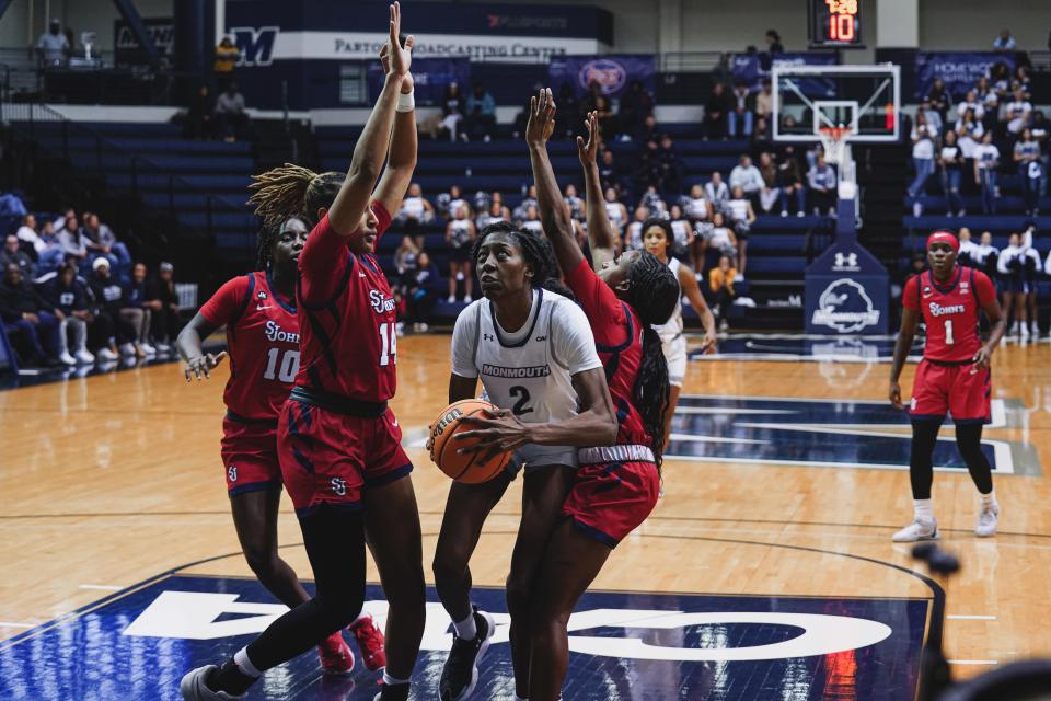 Monmouth's Taisha Exanor looks to get a shot off against St. John's at OceanFirst Bank Center on Nov. 11, 2023.
