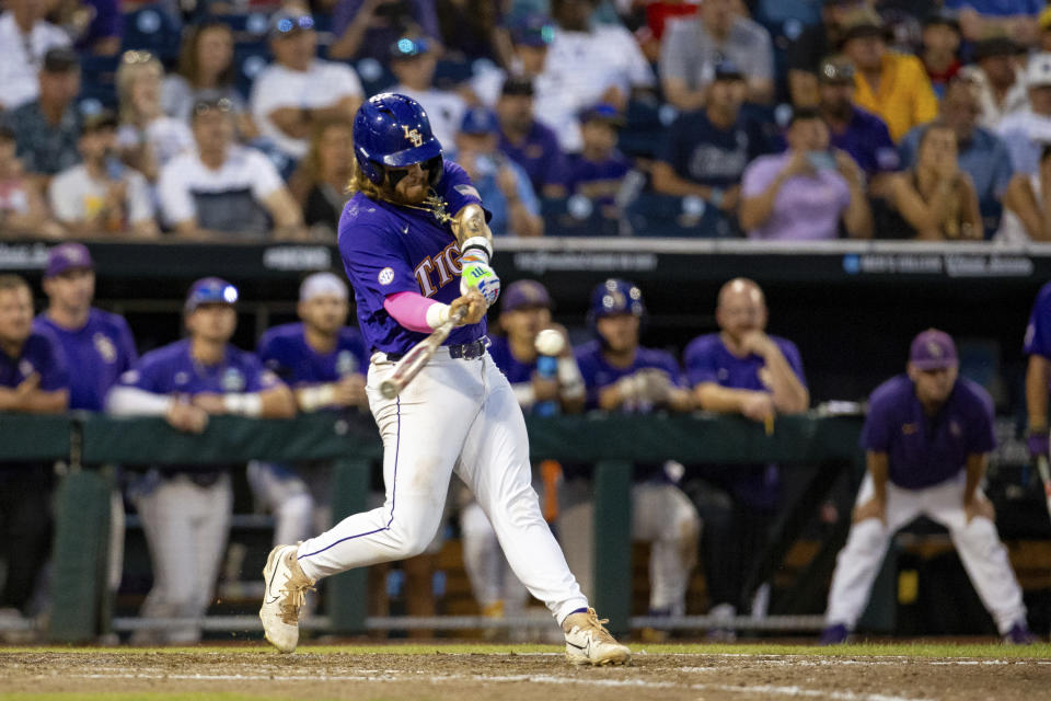 LSU's Tommy White (47) hits a home run against Wake Forest during the 11th inning in a baseball game at the NCAA College World Series in Omaha, Neb., Thursday, June 22, 2023. (AP Photo/John Peterson)