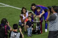 Lionel Messi, Antonella Roccuzzo and sons pose with the Copa del Rey trophy in Madrid in May 2017 after Messi's Barcelona side won the competition