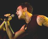 <p>Robbie was attacked and pushed off stage during a gig in Stuttgart, Germany, in 2001. A guy, who police said was believed to be suffering from psychiatric problems, charged at him from behind and knocked him five feet into the crowd. <i>Copyright [James D. Morgan/REX/Shutterstock]</i></p>