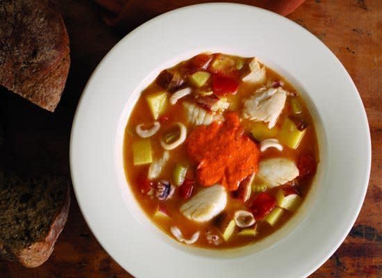Traditionally this Provencal stew was made by fishermen who used the freshest seafood caught that day. This at-home version features tilapia, scallops and squid. Serve it with rouille, a garlic and red pepper sauce.    <strong>Get the Recipe for <a href="http://www.huffingtonpost.com/2011/10/27/bouillabaisse-with-spicy-_n_1049842.html" target="_hplink">Bouillabaisse with Spicy Rouille</a></strong>