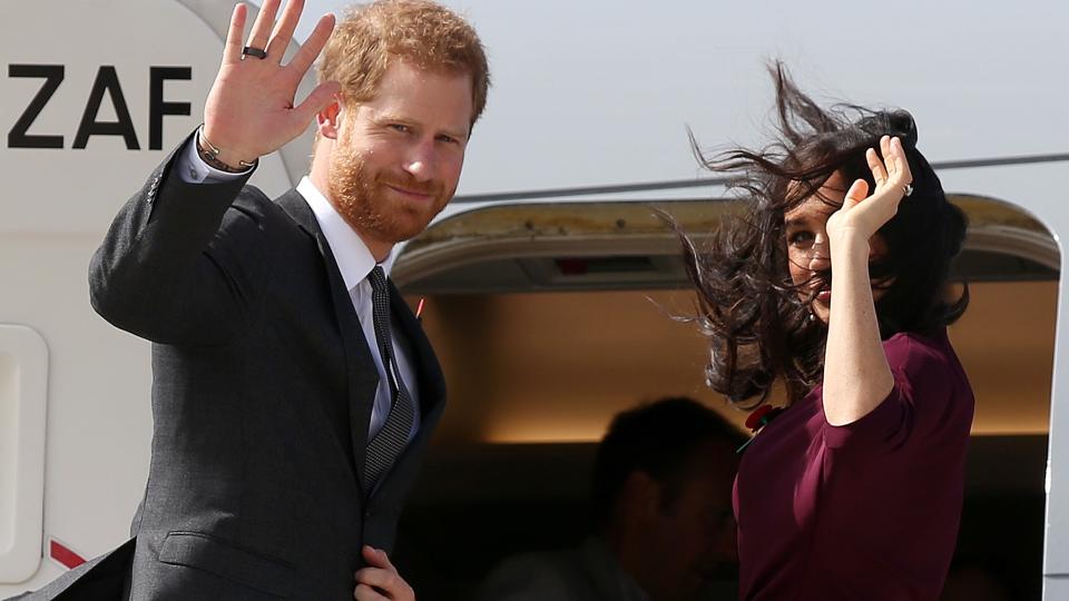 Prince Harry and Meghan Markle getting on a plane