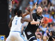 <p>Gonzaga Bulldogs center Przemek Karnowski (24) is defended by North Carolina Tar Heels forward Theo Pinson (1) in the first half in the championship game of the 2017 NCAA Men’s Final Four at University of Phoenix Stadium. Mandatory Credit: Bob Donnan-USA TODAY Sports </p>