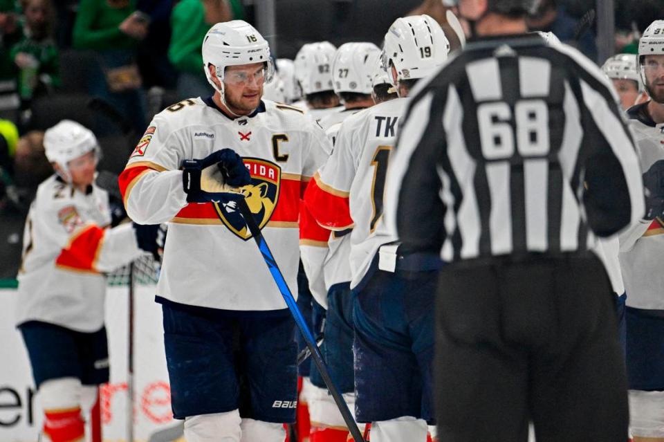 Mar 12, 2024; Dallas, Texas, USA; Florida Panthers center Aleksander Barkov (16) and left wing Matthew Tkachuk (19) celebrates after the Panthers defeat the Dallas Stars at the American Airlines Center. Mandatory Credit: Jerome Miron-USA TODAY Sports