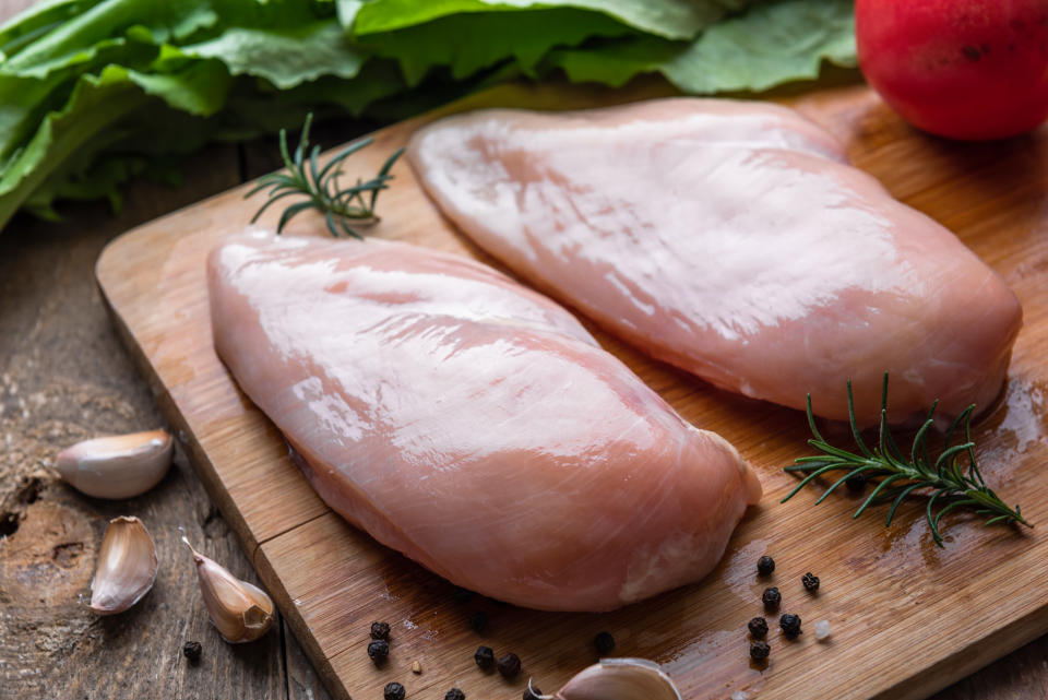 Raw chicken breast with ingredient