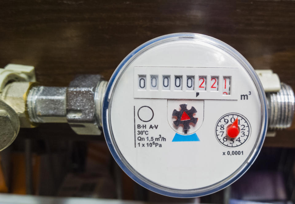 Close-up of a water meter displaying water usage volume.