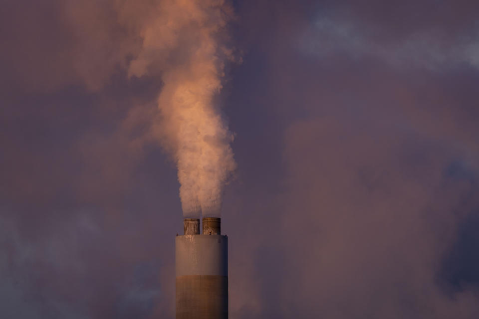 FILE - Carbon dioxide and other pollutants billows from a stack at PacifiCorp's coal-fired Naughton Power Plant, near where Bill Gates company, TerraPower plans to build an advanced, nontraditional nuclear reactor, Thursday, Jan. 13, 2022, in Kemmerer, Wyo. A major economic bill headed to the president has “game-changing” incentives for the nuclear energy industry, experts say, and those tax credits are even more substantial if a facility is sited in a community where a coal plant is closing. (AP Photo/Natalie Behring, File)