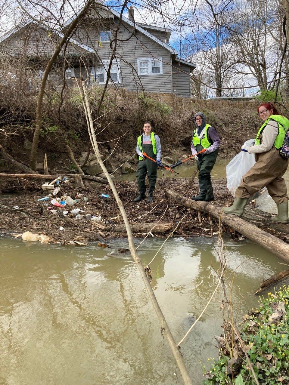 Volunteers remove trash and debris from outdoor spaces during a Keep Knoxville Beautiful event.