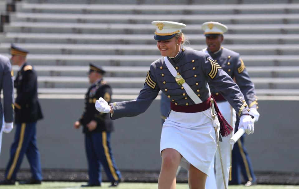 A cadet reacts to receiving her diploma and 2nd Lieutenants bars during the 2022 graduation and commissioning ceremony at the U. S. Military Academy at West Point in Highland Falls, N.Y. on Saturday, May 21, 2022.