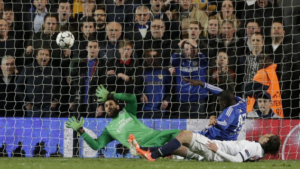 Chelsea's Demba Ba, in blue right, score his sides second goal of the game during the Champions League quarterfinal second leg soccer match between Chelsea and Paris Saint Germain at Stamford Bridge stadium in London, Tuesday, April 8, 2014. (AP Photo/Matt Dunham).