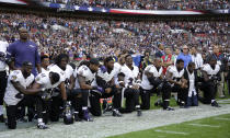 <p>Baltimore Ravens players, including former player Ray Lewis, second from right, kneel down during the playing of the U.S. national anthem before an NFL football game against the Jacksonville Jaguars at Wembley Stadium in London, Sunday Sept. 24, 2017. (AP Photo/Matt Dunham) </p>