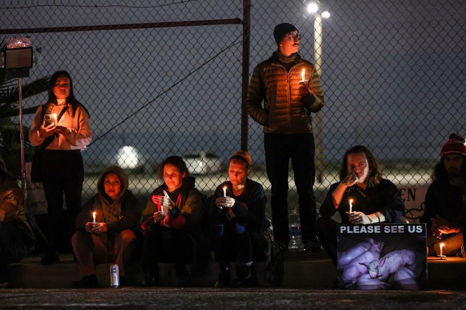 Activists gather one last time outside Farmer John meat processing plant.