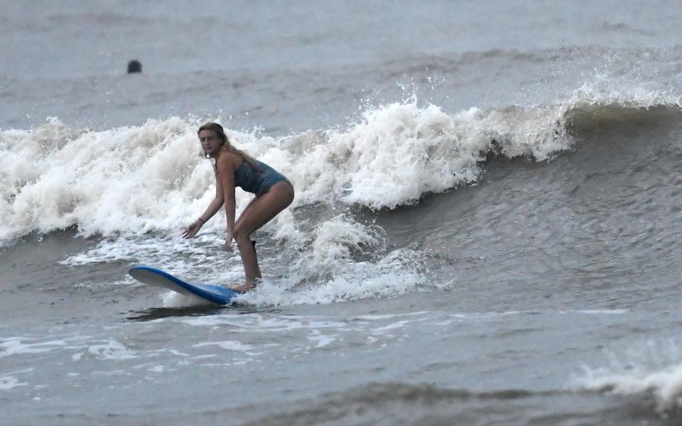 Surfers attend J.P. Luby Park ahead of Tropical Storm Hanna, Friday, July 24, 2020.