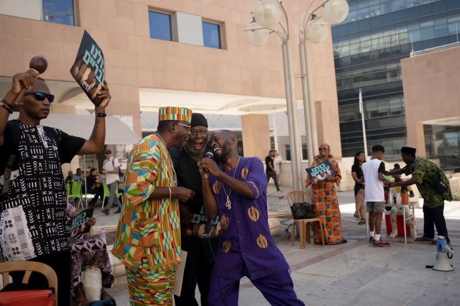 Members of the Hebrew Israelite community sing together during a rally outside of the District Court in Beersheba, Israel, ahead of a hearing on the deportation orders for dozens from their community, Wednesday, July 19, 2023. The community’s decades-long plight to secure their status shines a light on Israel’s strict immigration policy, which grants people whom it considers Jewish automatic citizenship but limits entry to others who don’t fall within that definition. (AP Photo/Maya Alleruzzo)