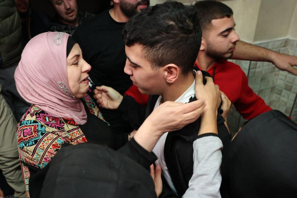 A Palestinian mother welcoming home her son Ahmad Salaima - one of the prisoners released by Israel (AFP via Getty Images)