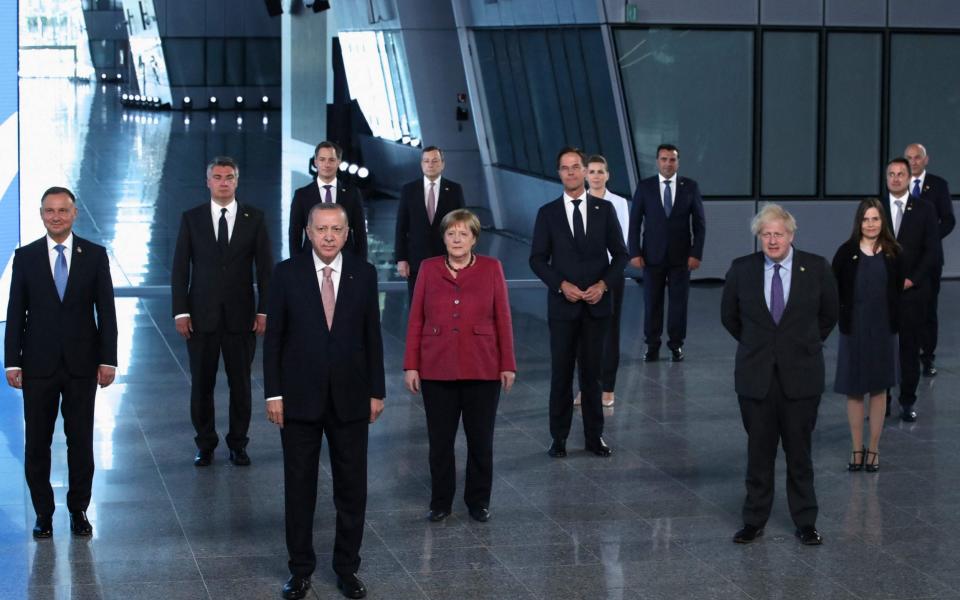 Nato heads of state and heads of government pose for a family photo in Brussels - AFP/YVES HERMAN