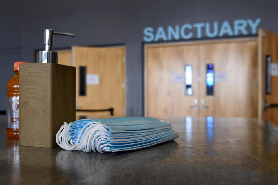 Hand sanitizer and face masks are placed on tables at the sanctuary entrance of a church in Las Vegas on May 31. (Photo: Ethan Miller via Getty Images)