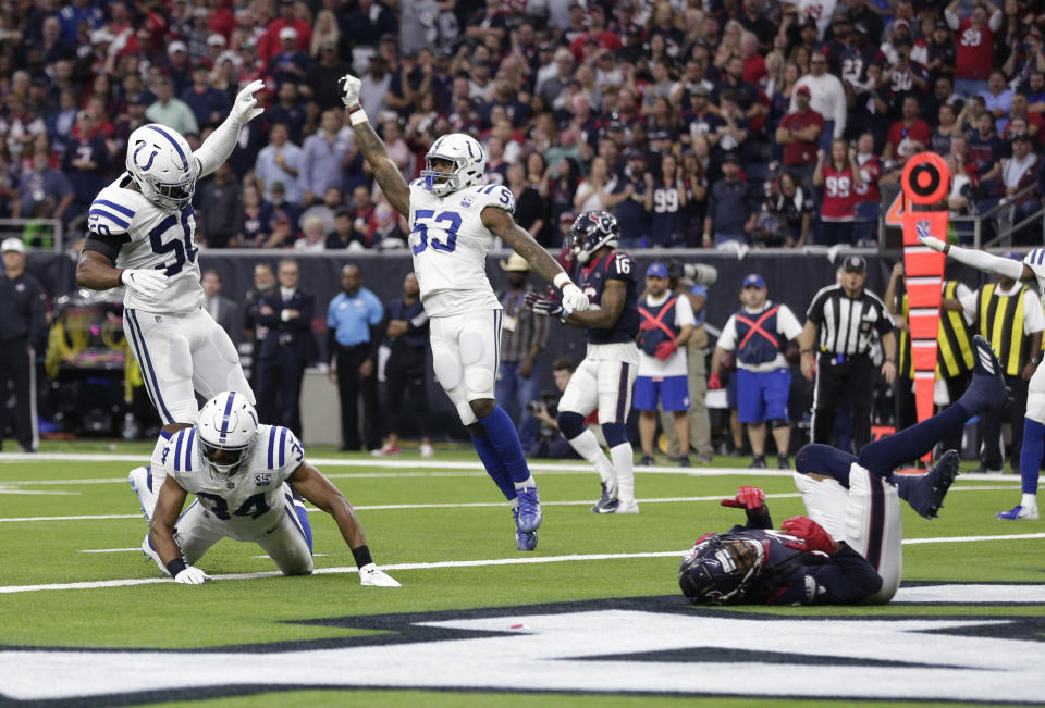 The Colts celebrate after a fourth-down pass to DeAndre Hopkins fell incomplete. (AP)