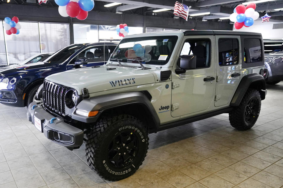 An electric Jeep Wrangler is displayed on the showroom floor at the Dan O'Brien Auto Group dealership, Monday, Feb. 27, 2023, in Methuen, Mass. Leasing is starting to look like the cheapest way to get an electric vehicle, because the U.S. government is giving it a big advantage. Dealers can apply up to the full $7,500 U.S. tax credit to leases of all electric vehicles regardless of where they're made. (AP Photo/Charles Krupa)
