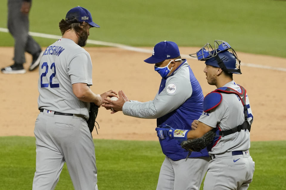 Los Angeles Dodgers starting pitcher Clayton Kershaw (22) leaves the game against the Atlanta Braves during the sixth inning in Game 4 of a baseball National League Championship Series Thursday, Oct. 15, 2020, in Arlington, Texas. (AP Photo/Tony Gutierrez)