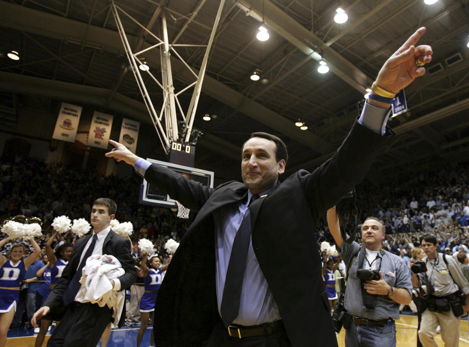 FILE - Duke coach Mike Krzyzewski celebrates after the No. 7 Blue Devils beat No. 7 North Carolina 71-70 at Cameron Indoor Stadium in Durham, N.C., Wednesday, Feb. 9, 2005. (AP Photo/Gerry Broome, File)