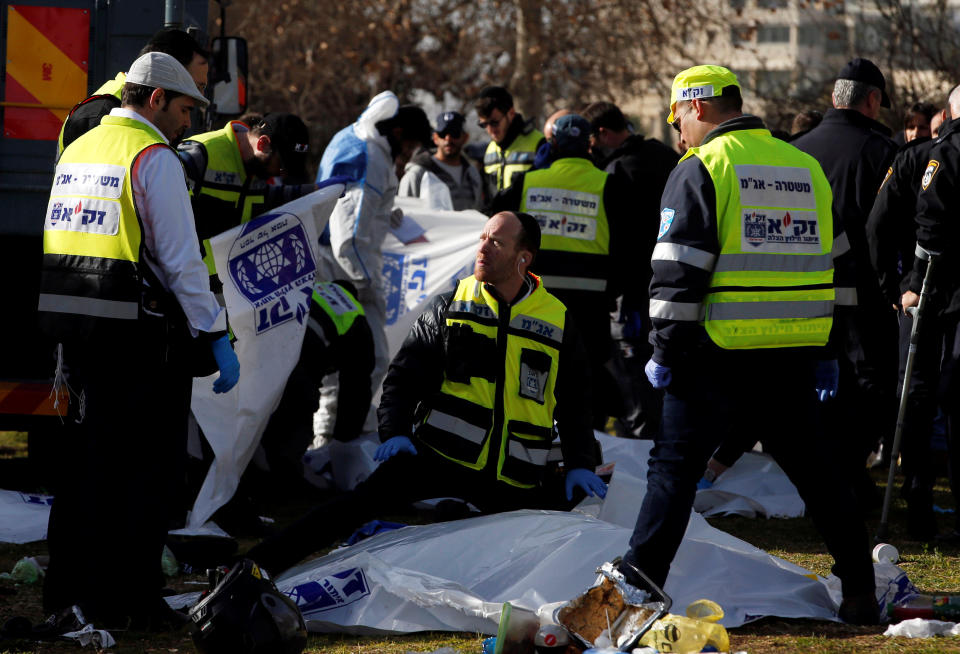 Israeli rescue forces work at the scene of a truck-ramming incident in Jerusalem January 8, 2017 REUTERS/Ronen Zvulun