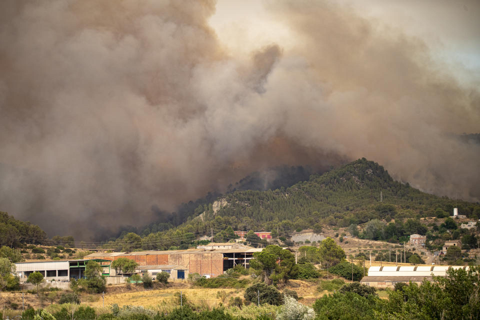 BARCELONA, CATALONIA, SPAIN - JULY 17: Smoke from a forest fire, on 17 July, 2022 in Pont de Vilomara, Barcelona, Catalonia, Spain. The fire has started today Sunday at noon and already affects 95 hectares, in its extinction work 81 teams of the Bombers de la Generalitat, of which 13 are aerial. The fire, fanned by the south wind, advances 