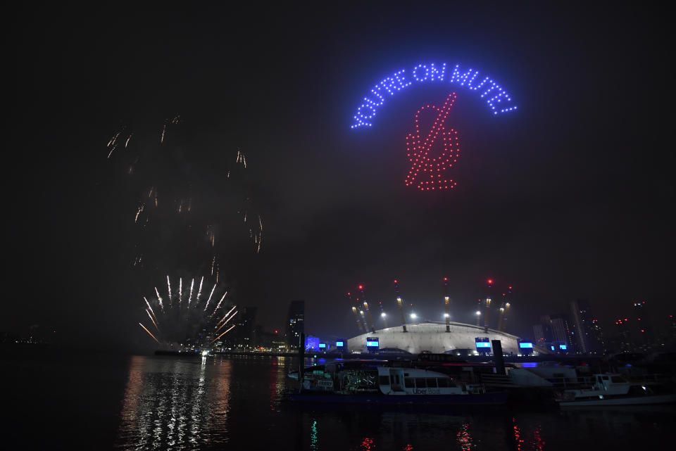 Fireworks and drones illuminate the night sky over London as they form a light display as London's normal New Year's Eve fireworks display was cancelled due to the coronavirus pandemic.