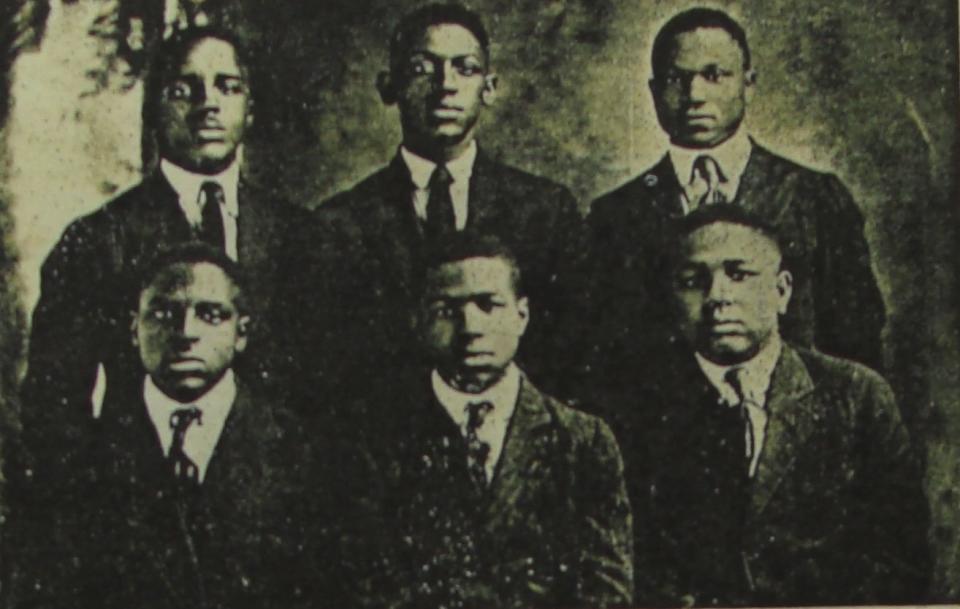 Ed Goodwin (top middle) with his high school classmates in early 1921. Ed was days away from graduating when a white mob burned Greenwood to the ground.<span class="copyright">Photo Credit: Jeanne Osby Goodwin Arradondo Family Collection</span>