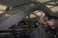 New York Mayor Bill de Blasio speaks in front of the 94-foot-long, 21,000-pound model of a blue whale, wearing a bandage, at the COVID-19 vaccination site, in the Milstein Family Hall of Ocean Life, at the American Museum of Natural History, in New York, Friday, April 23, 2021. (AP Photo/Richard Drew)
